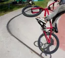Child doing tricks on a BMX bike