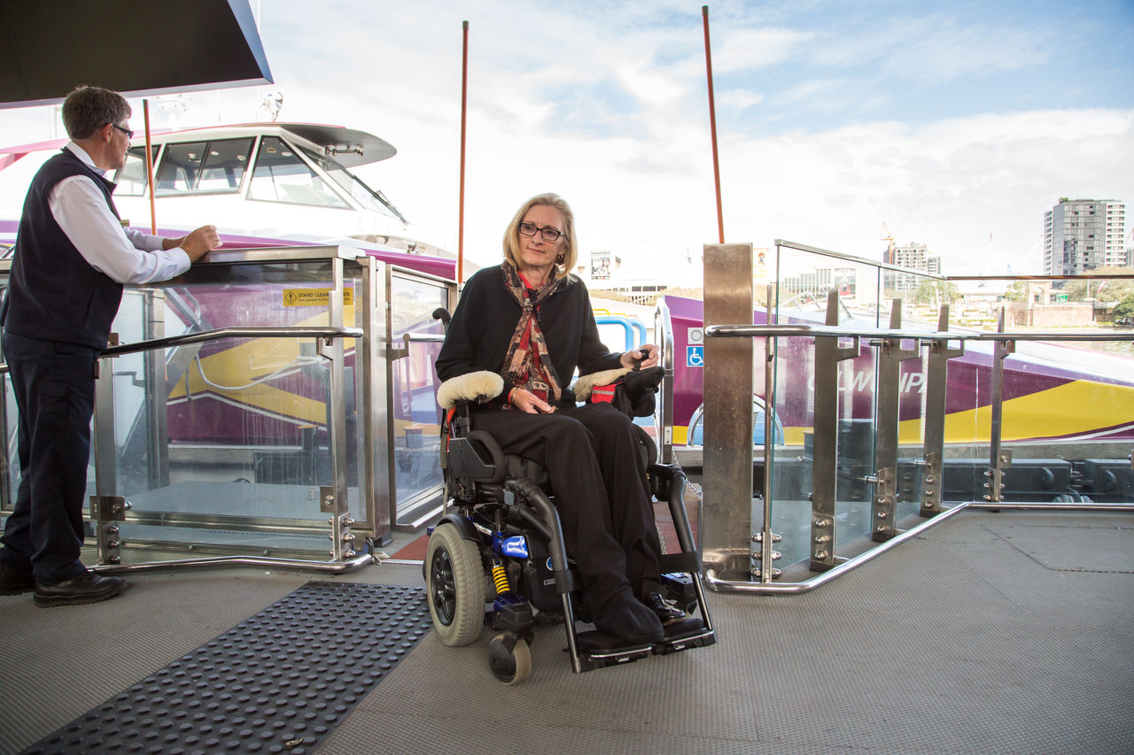 Woman in wheel chair exiting at north quay accessibility ferry terminal 12