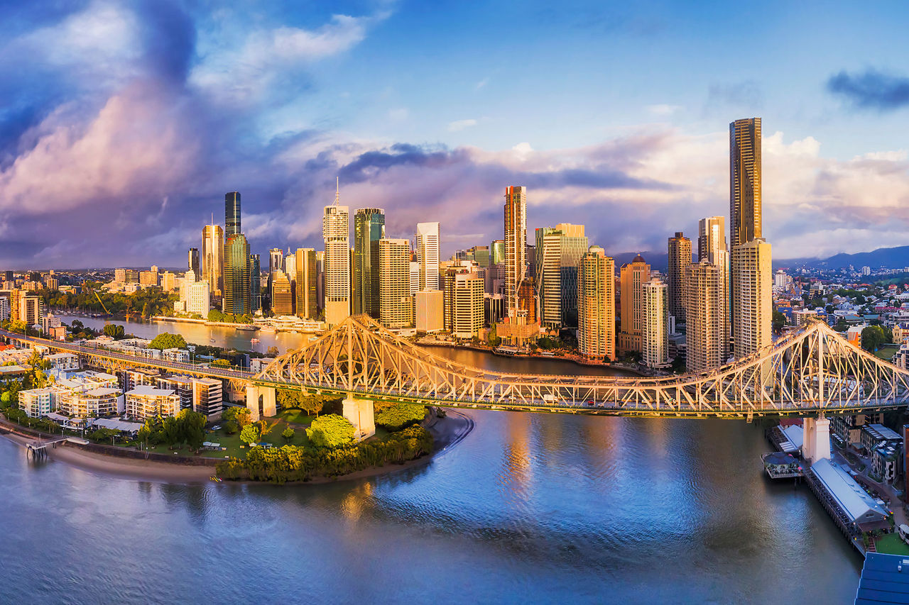 Brisbane river at twilight featuring story bridge and city skyline