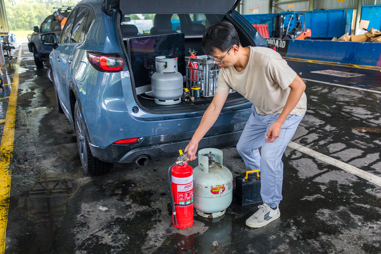 Man dropping hazardous waste, including a fire hydrant and gas bottle, to Willawong Resource Recovery Centre.