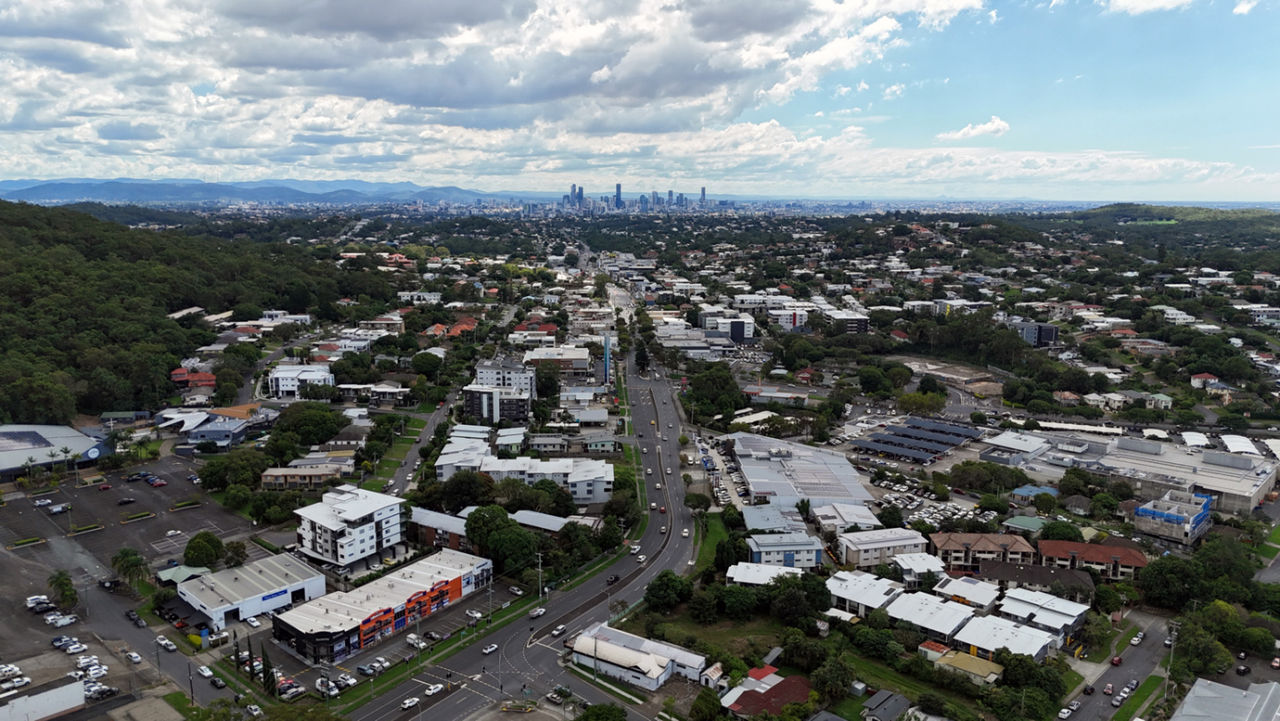 Aerial view of Mt Gravatt with the Brisbane City skyline seen on the horizon.