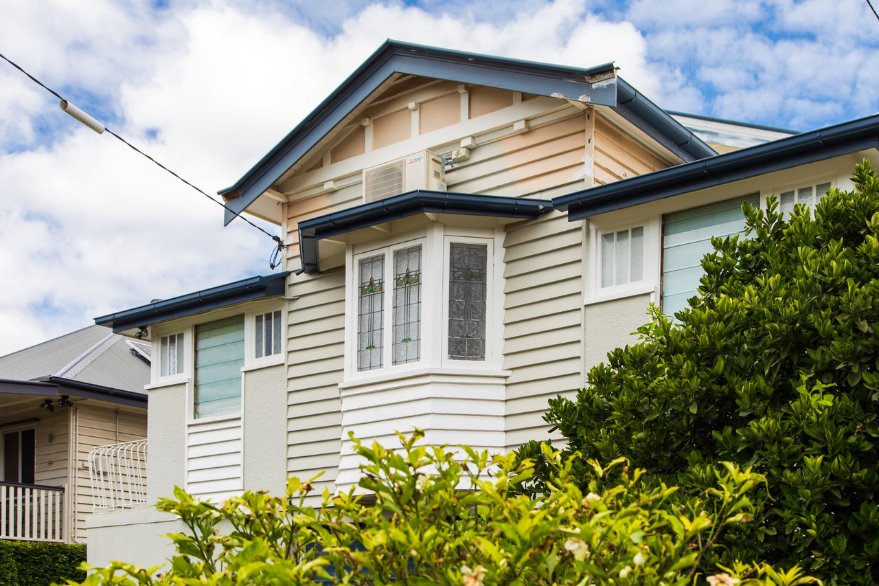 Traditional Brisbane character house with tall windows and attic.
