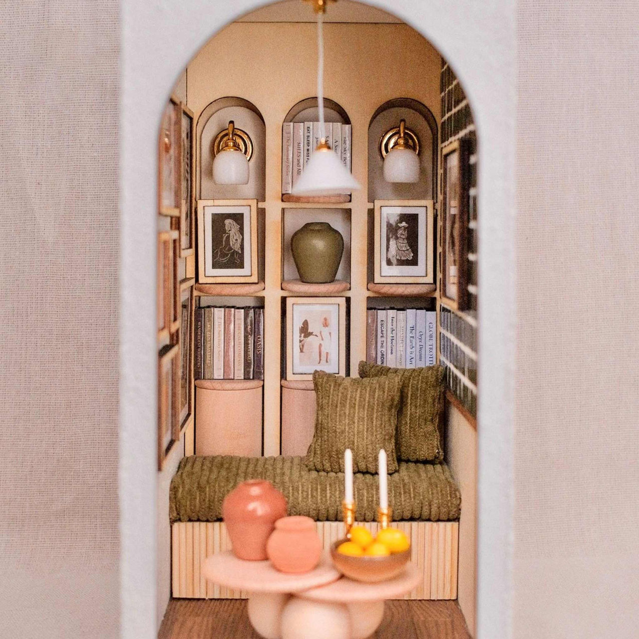 Artwork by LettyCo showing a lounge room and arch with books.