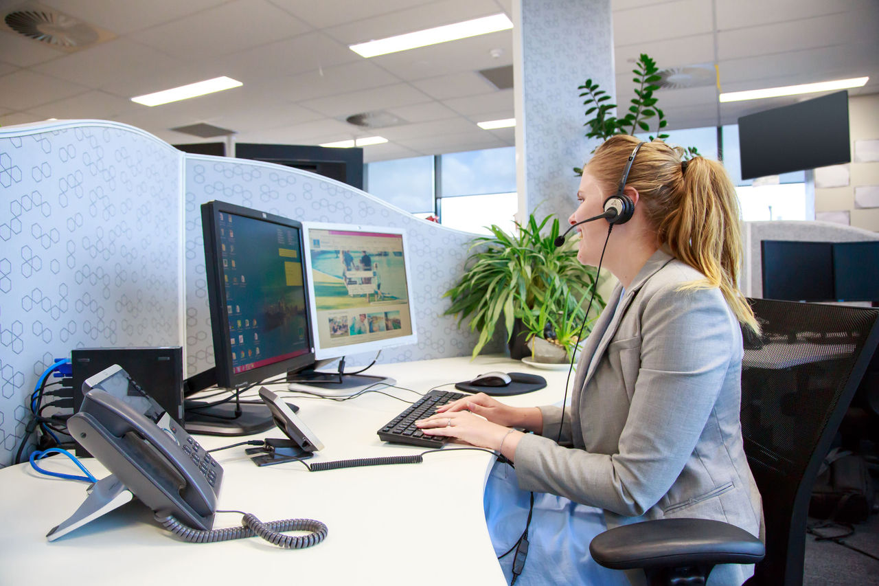 Female consultant taking a customer call.