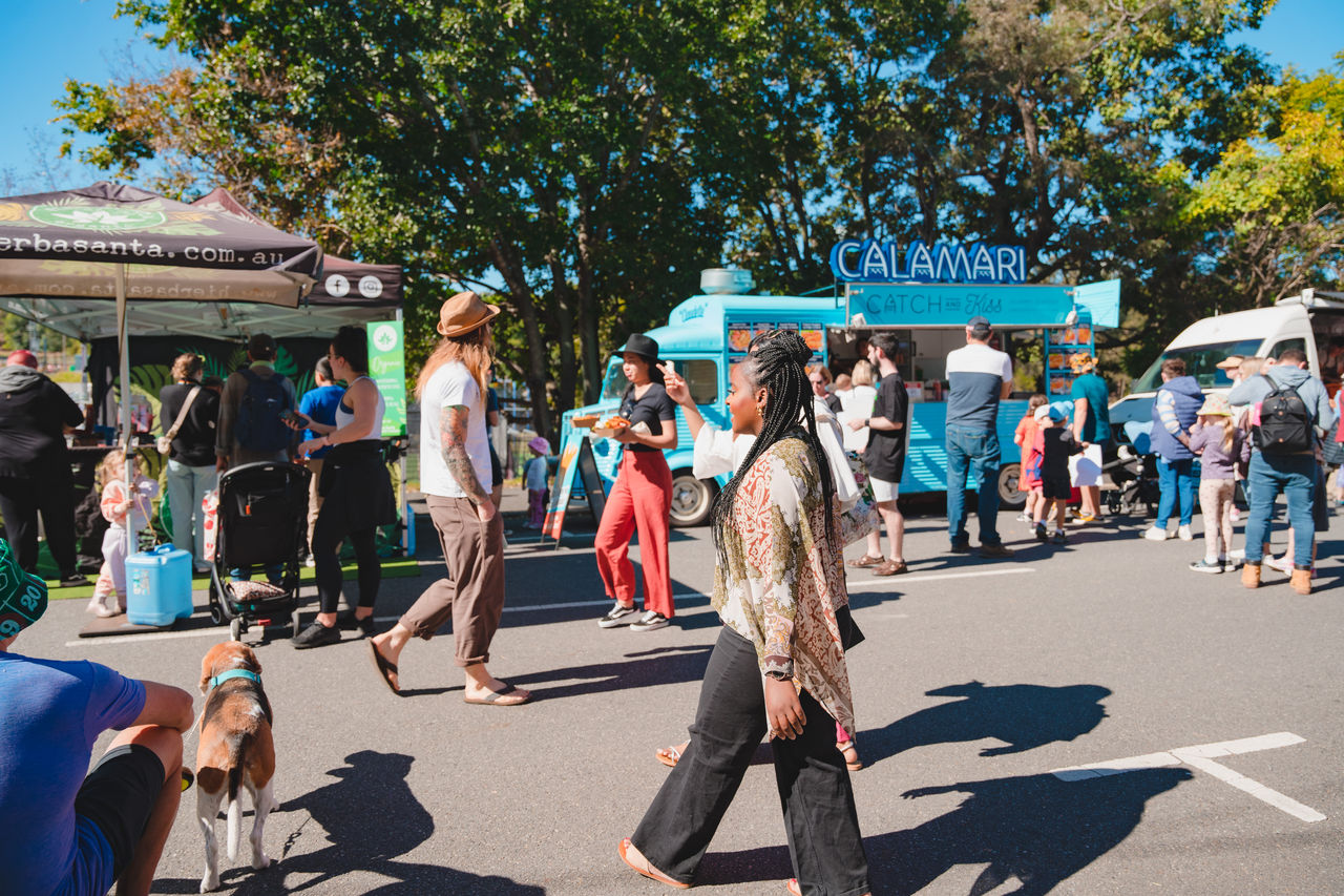 People wandering around a Green Heart Fair event.