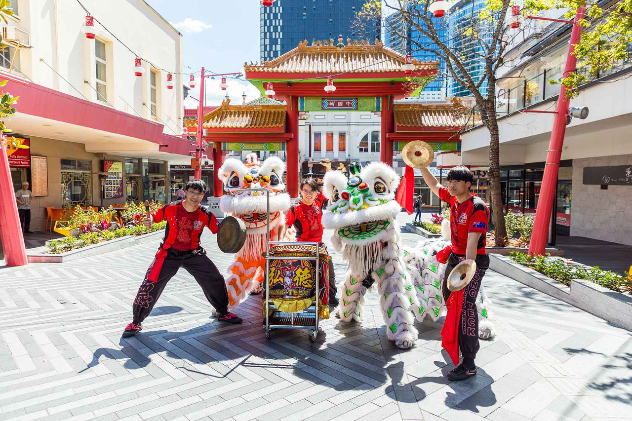 Three performers with 2 lions in Chinatown Mall, Fortitude Valley. for Moon Festival.