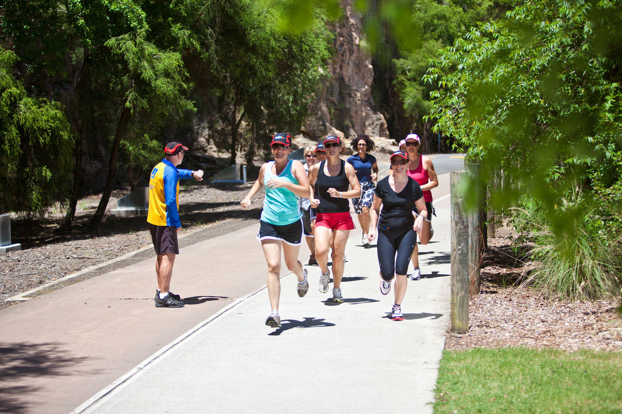 Group of women running at Kangaroo Point Cliffs with a male coach. Part of Active & Healthy program.