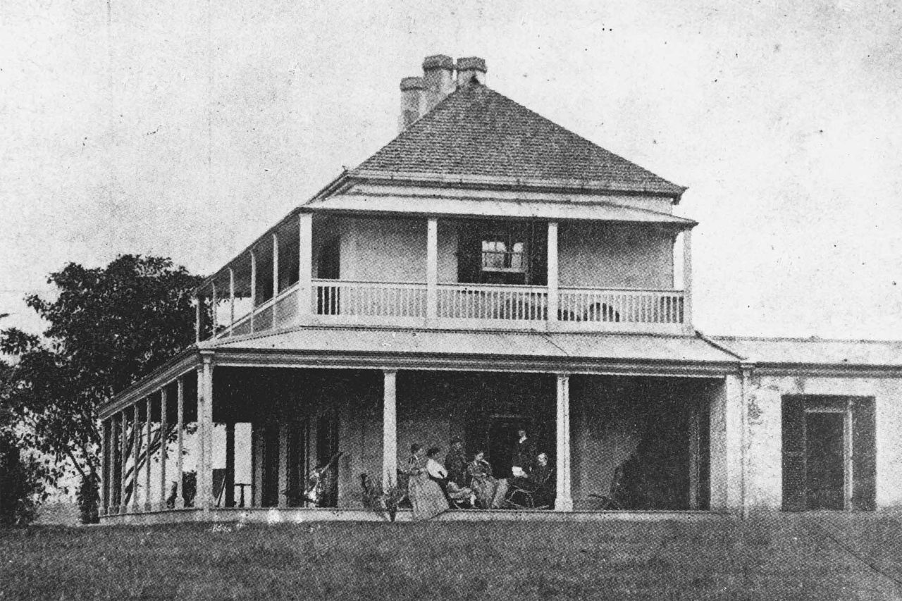 Members of the Manning family on the side of the verandah of Milton House, circa 1870 (State Library of Queensland) image.