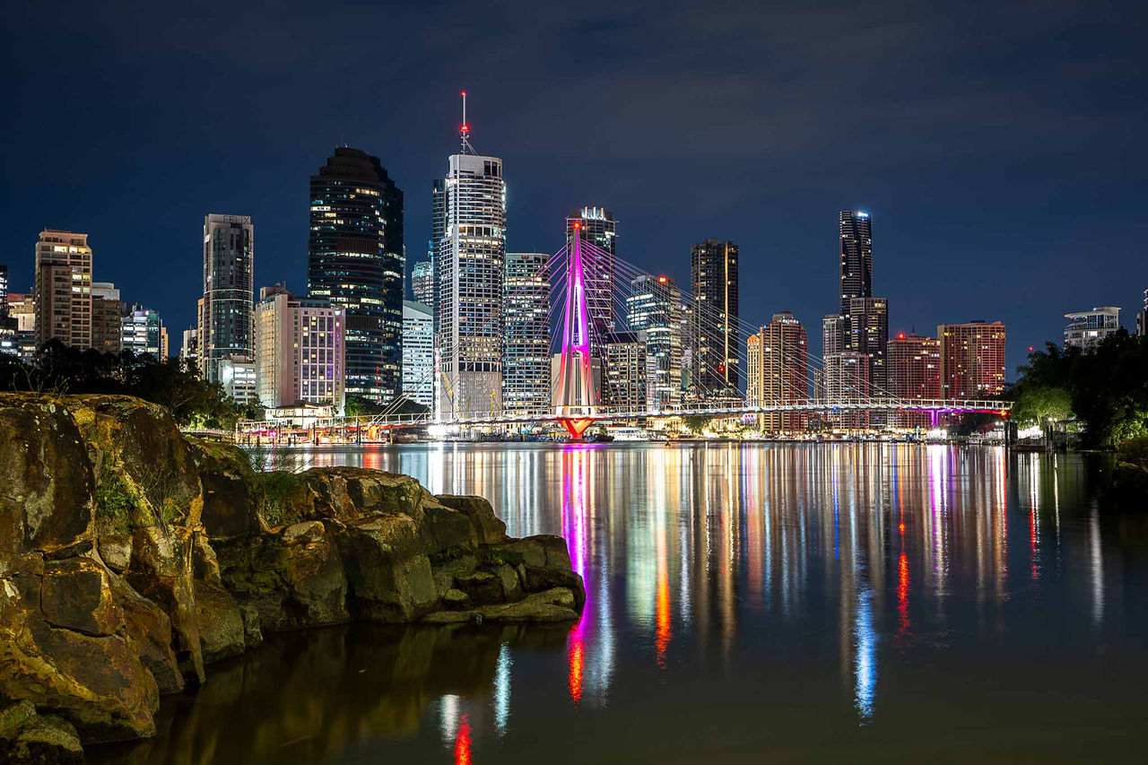 An image of reflections on the Brisbane River at night by photographer Daniel Fewquandie. Submitted as part of Lord Mayor's Photographic Awards 2025.