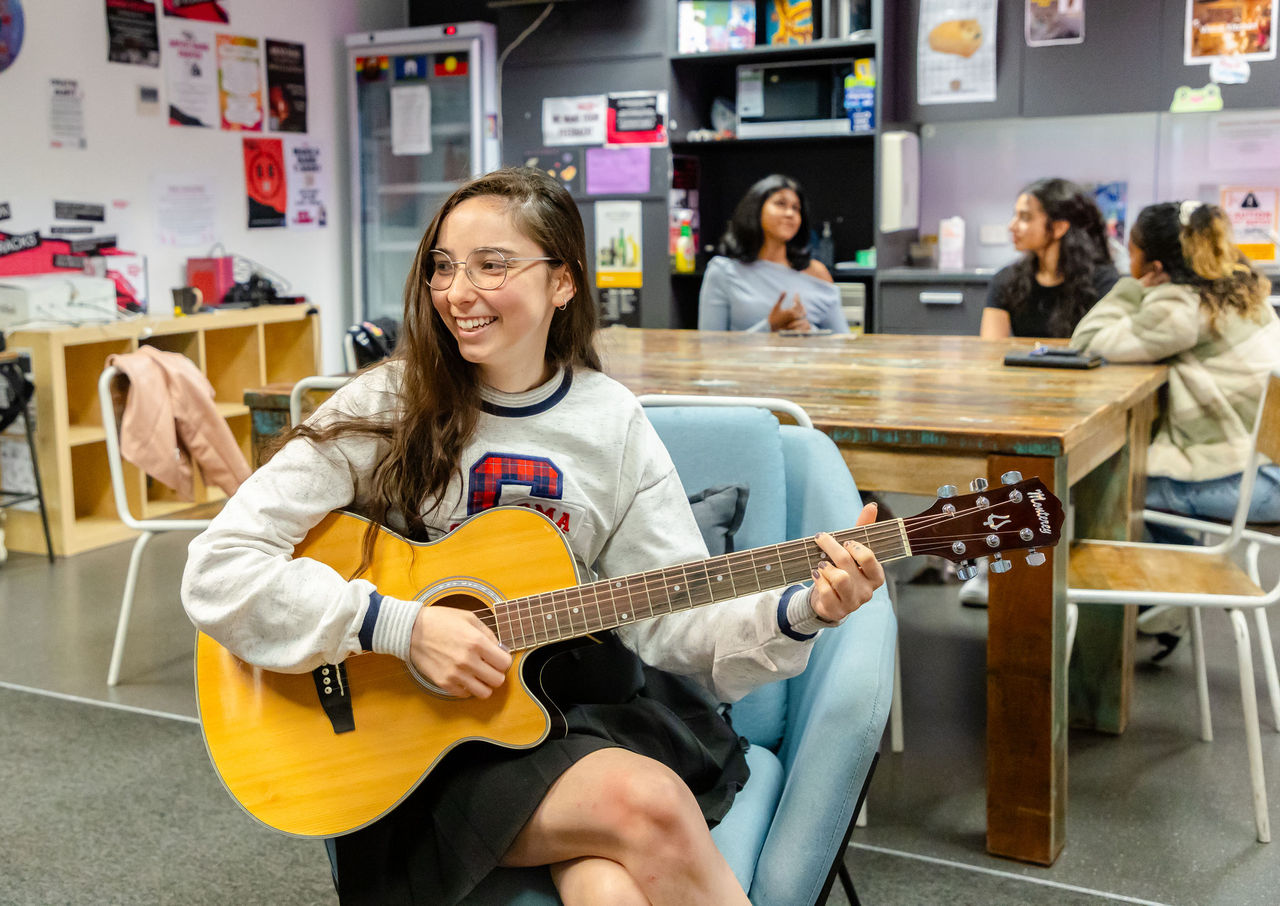 Girl playing guitar 
