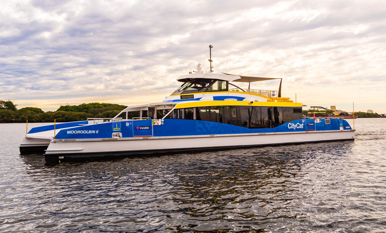 CityCat named Mooroolbin II on the Brisbane River at sunset.
