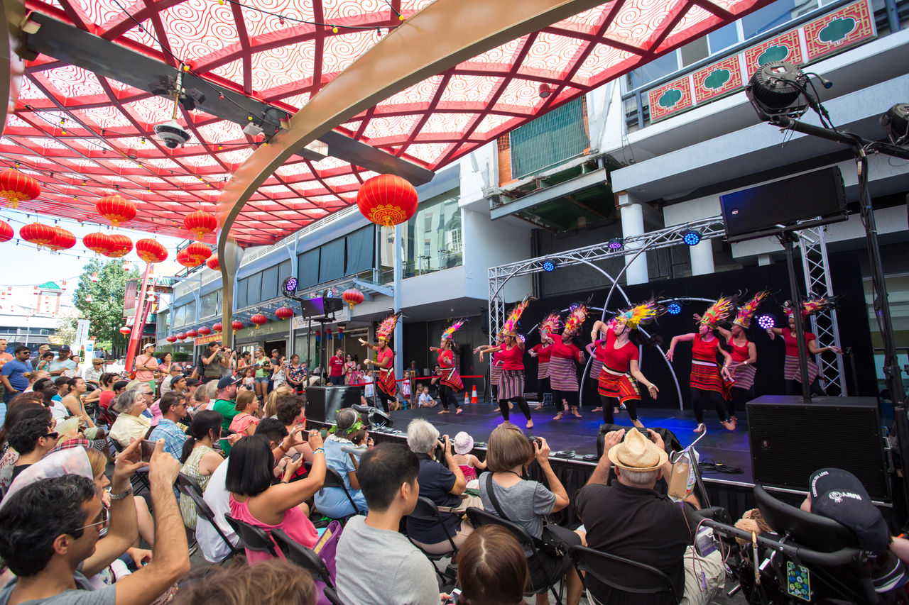Filipino dancers on stage in Chinatown Mall, Fortitude Valley. Crowd watching on.