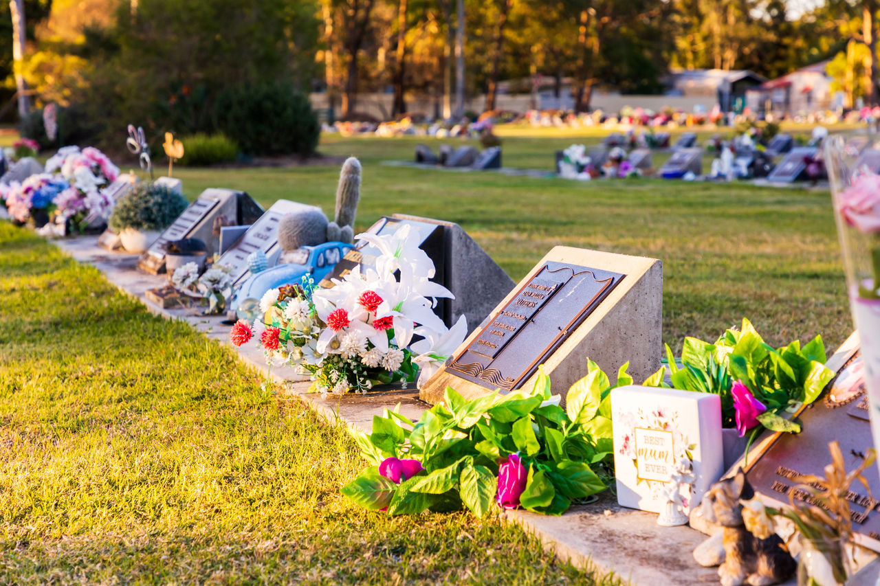 Graves with flowers and tributes at Hemmant Cemetery.