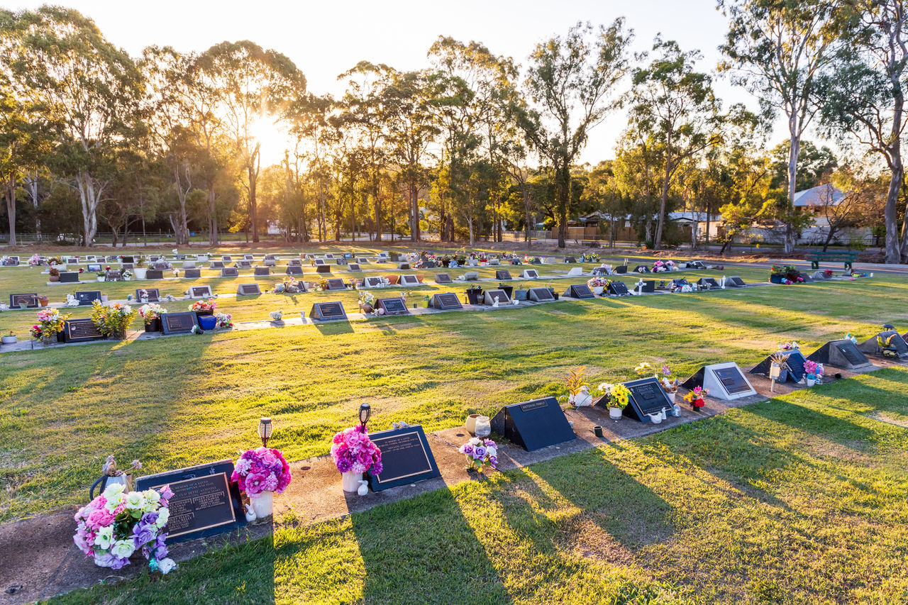 Lawn graves at sunset at Hemmant Cemetery.