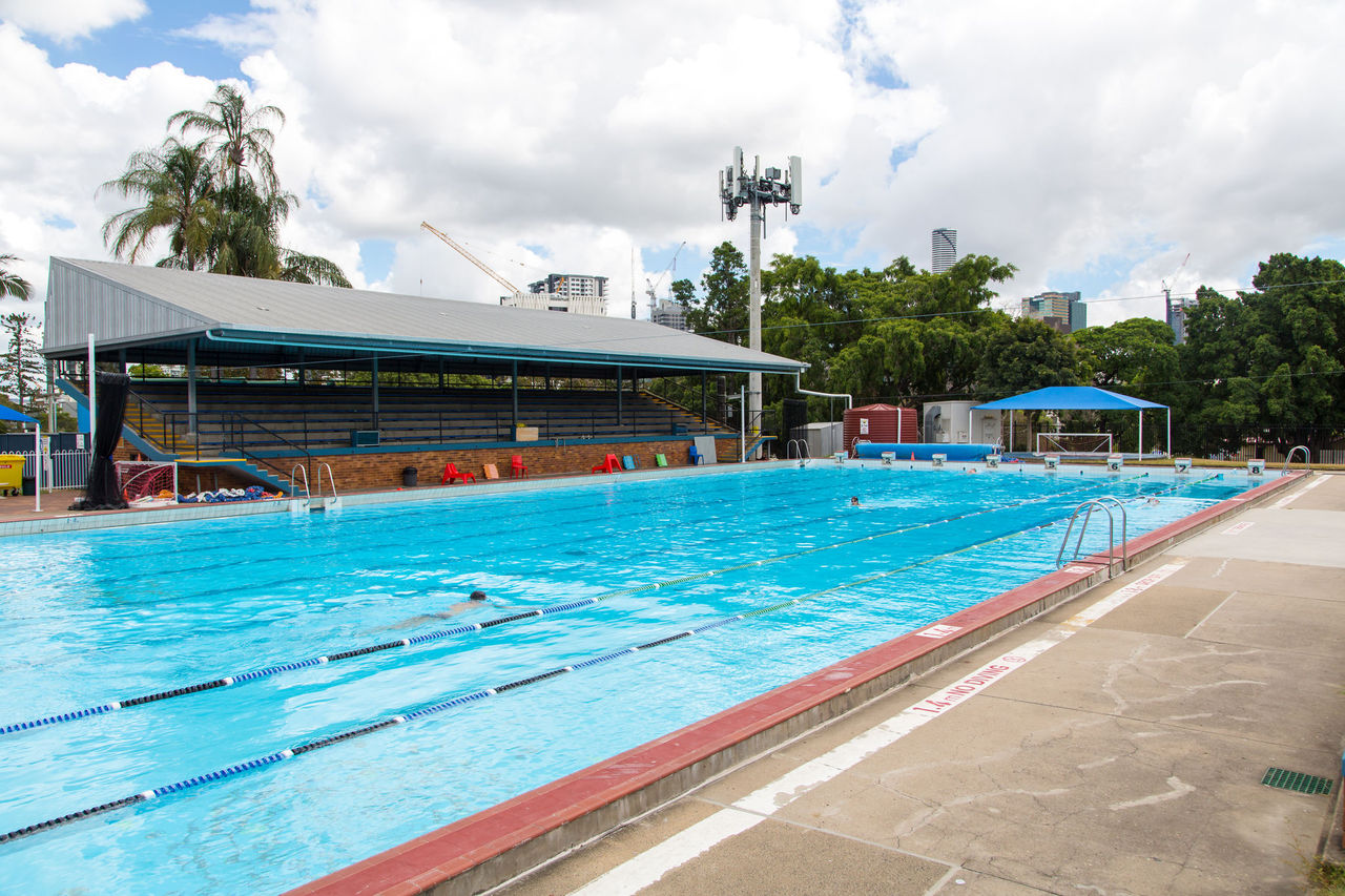 50-metre outdoor pool at Musgrave Park Swimming Centre. 2 lap swimmers in pool.