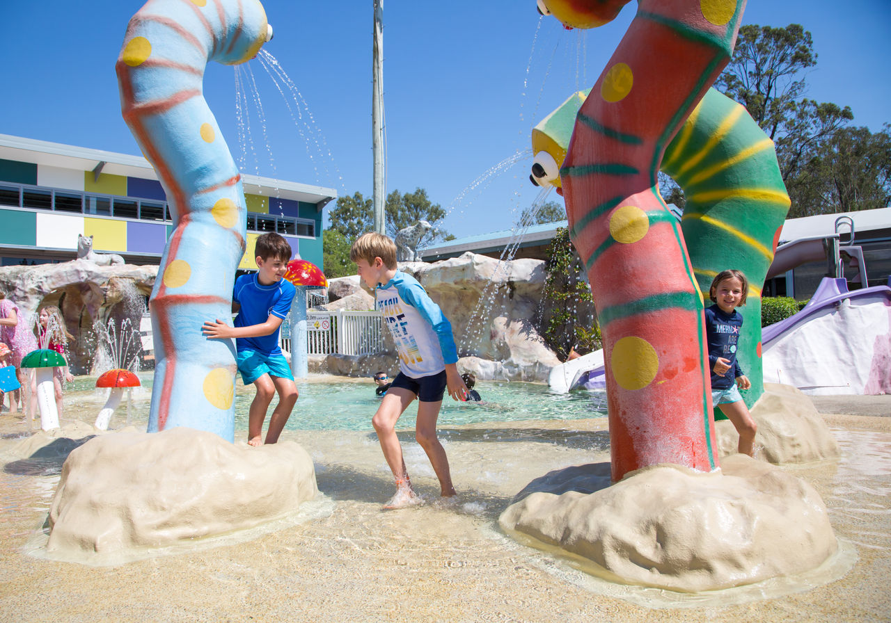 Kids playing in water play area at Newmarket Olympic Swimming Pool.