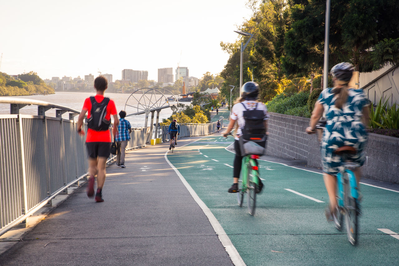 Bike riders and walkers using shared pathway along the Bicentennial Bikeway outbound toward Toowong in the afternoon.