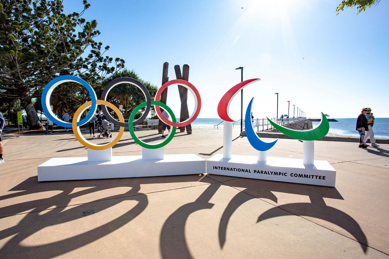 Wynnum Manly Foreshore Olympics Activation with foreshore in the background and pedestrians strolling.
