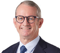 Portrait of Councillor Adam Allan looking at camera.