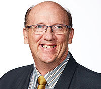 Portrait of Councillor Charles Strunk looking at camera.