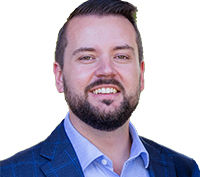 Portrait of Councillor Jared Cassidy looking at camera.