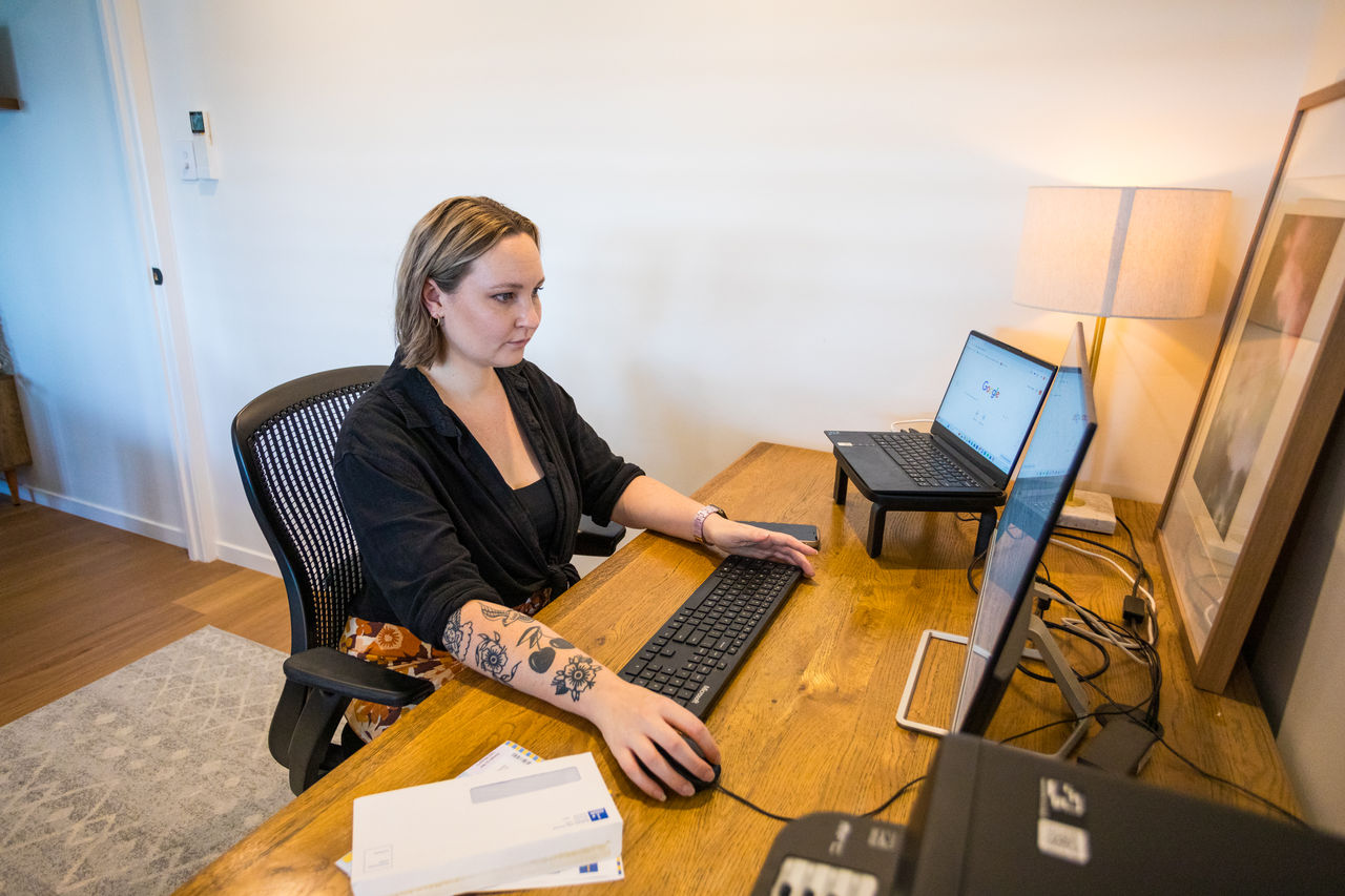 Desk setup with a laptop and notebook, preparing an operational work application