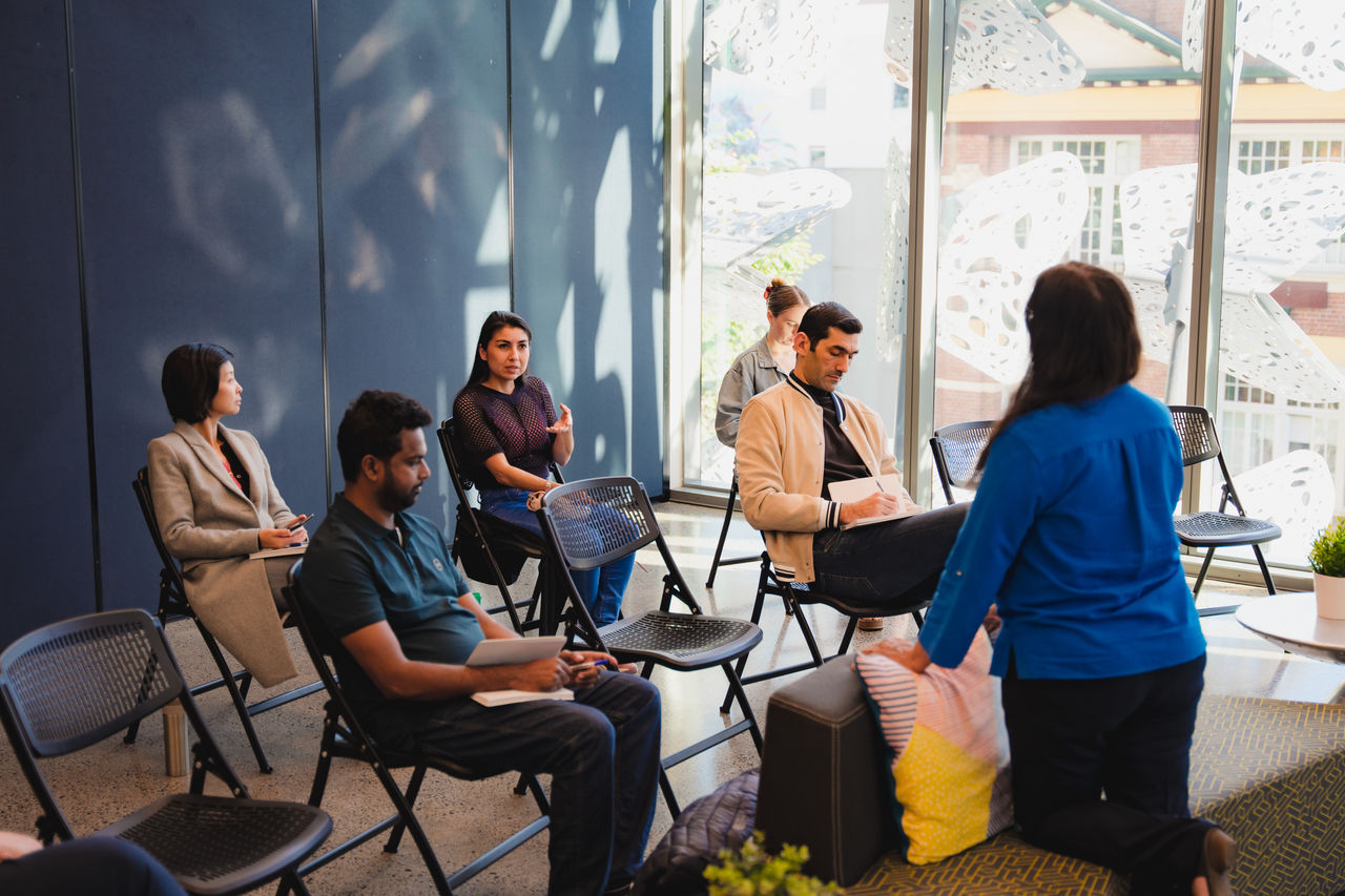 5 participants and a female facilitator in an event at Brisbane Business Hub.