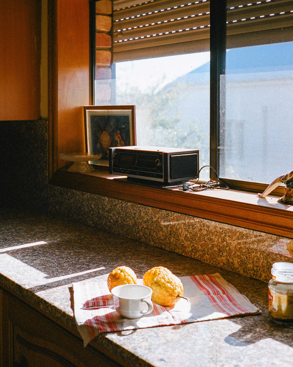 LMPA 2026 Peoples Choice Finalist - Conner Gouws - Morning Lemon Coffee. A sun-soaked kitchen bench with a mug and lemons waiting for a coffee to be made.