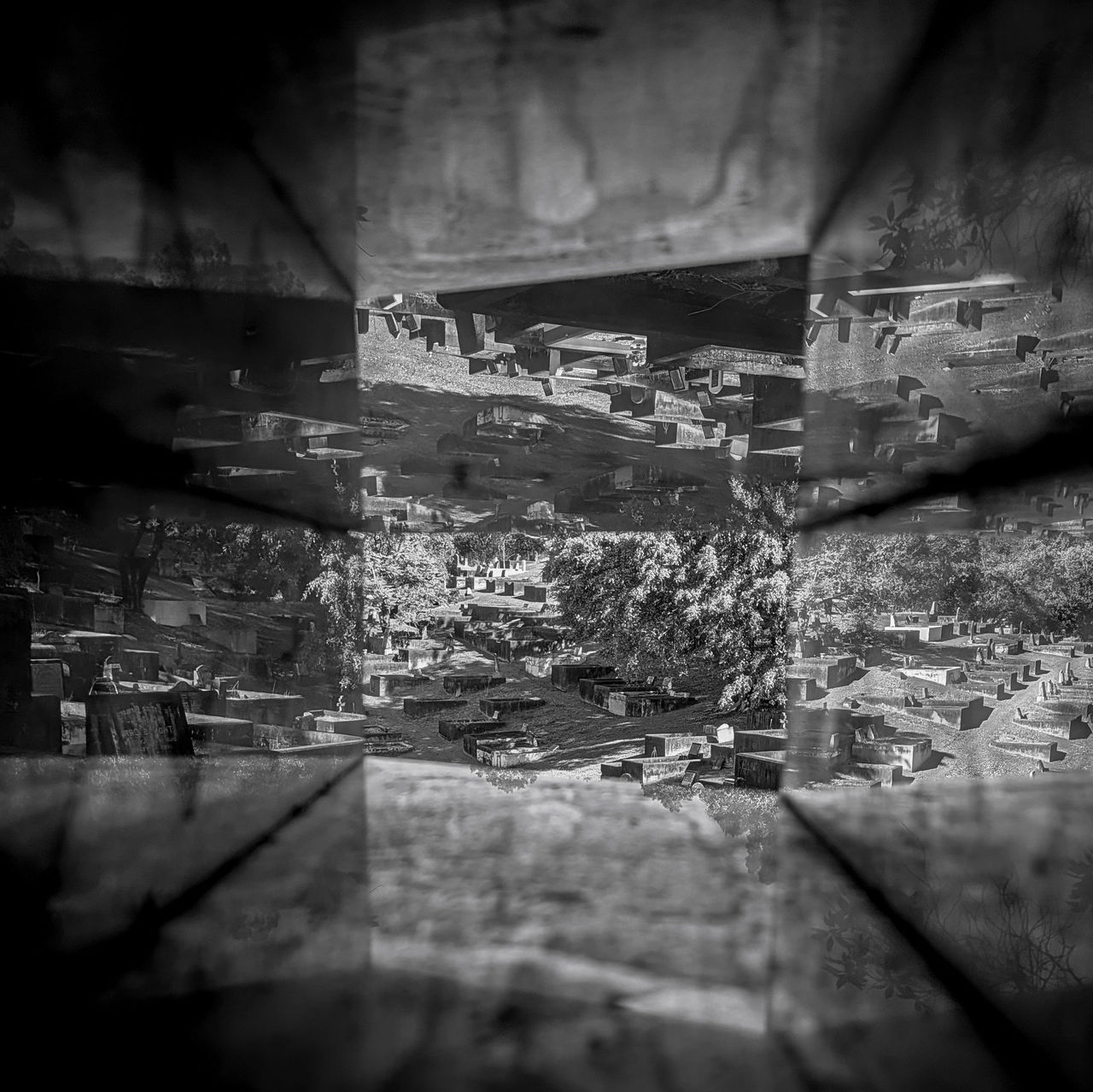 LMPA 2026 Peoples Choice Finalist - Sarah ONeill - Remembering. A blakc and white image of a cemetery viewed through a reflective box.