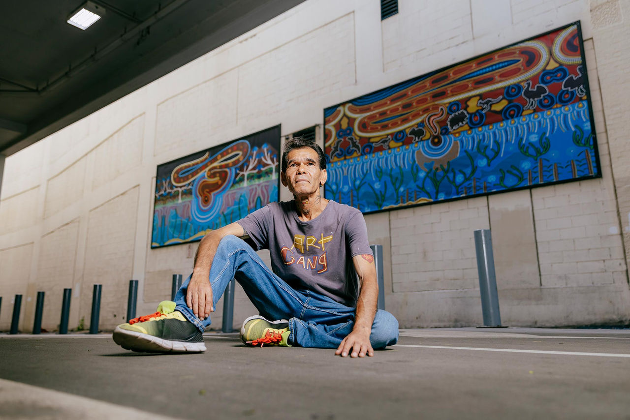 Artist Duane Doyle with his AMPLIFY ME! Outdoor Gallery exhibition artworks.