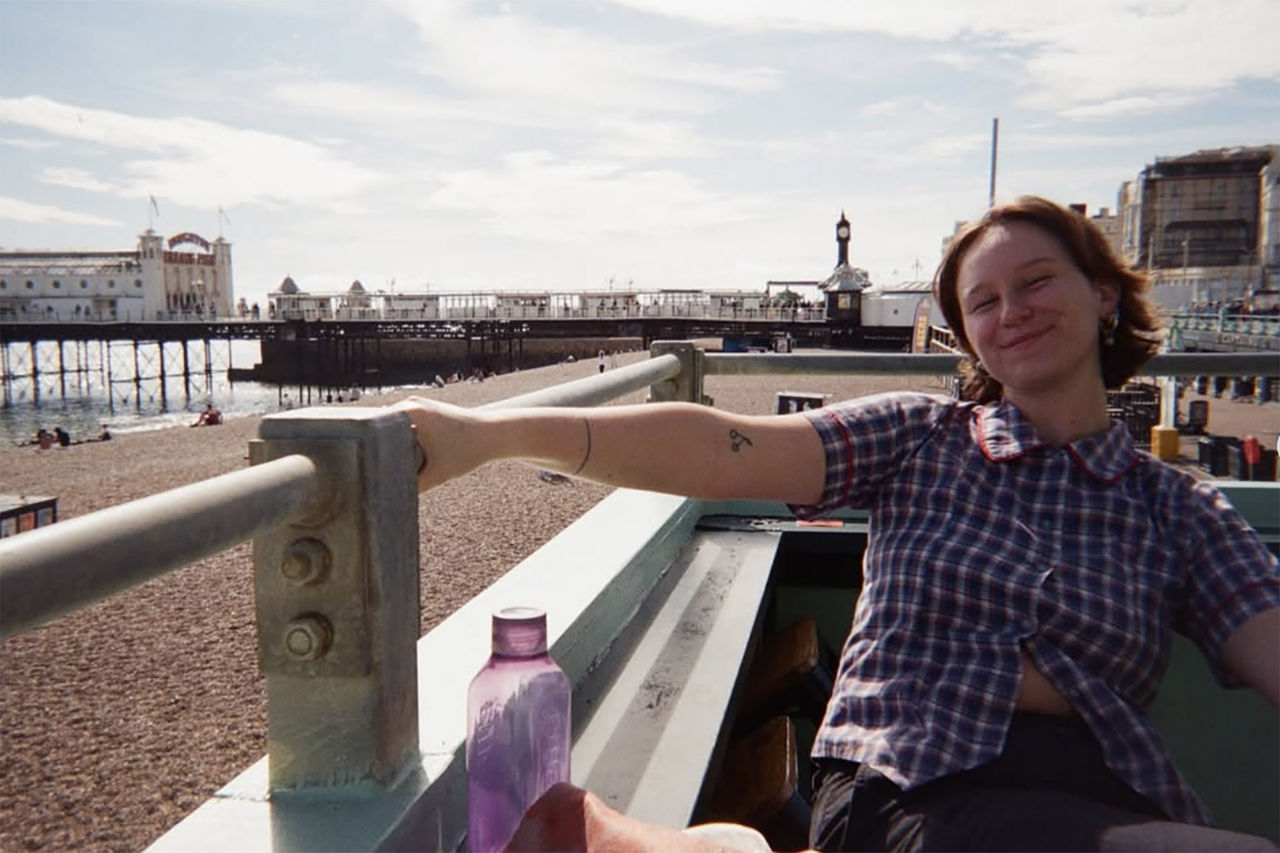 Image of Marli Smales, mentor, The QUBE Effect 2026. Photo is at a beach.