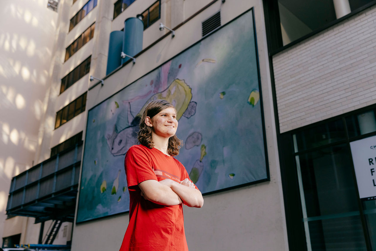William Melrose in front of his artwork included in the AMPLIFY ME! Outdoor Gallery exhibition.