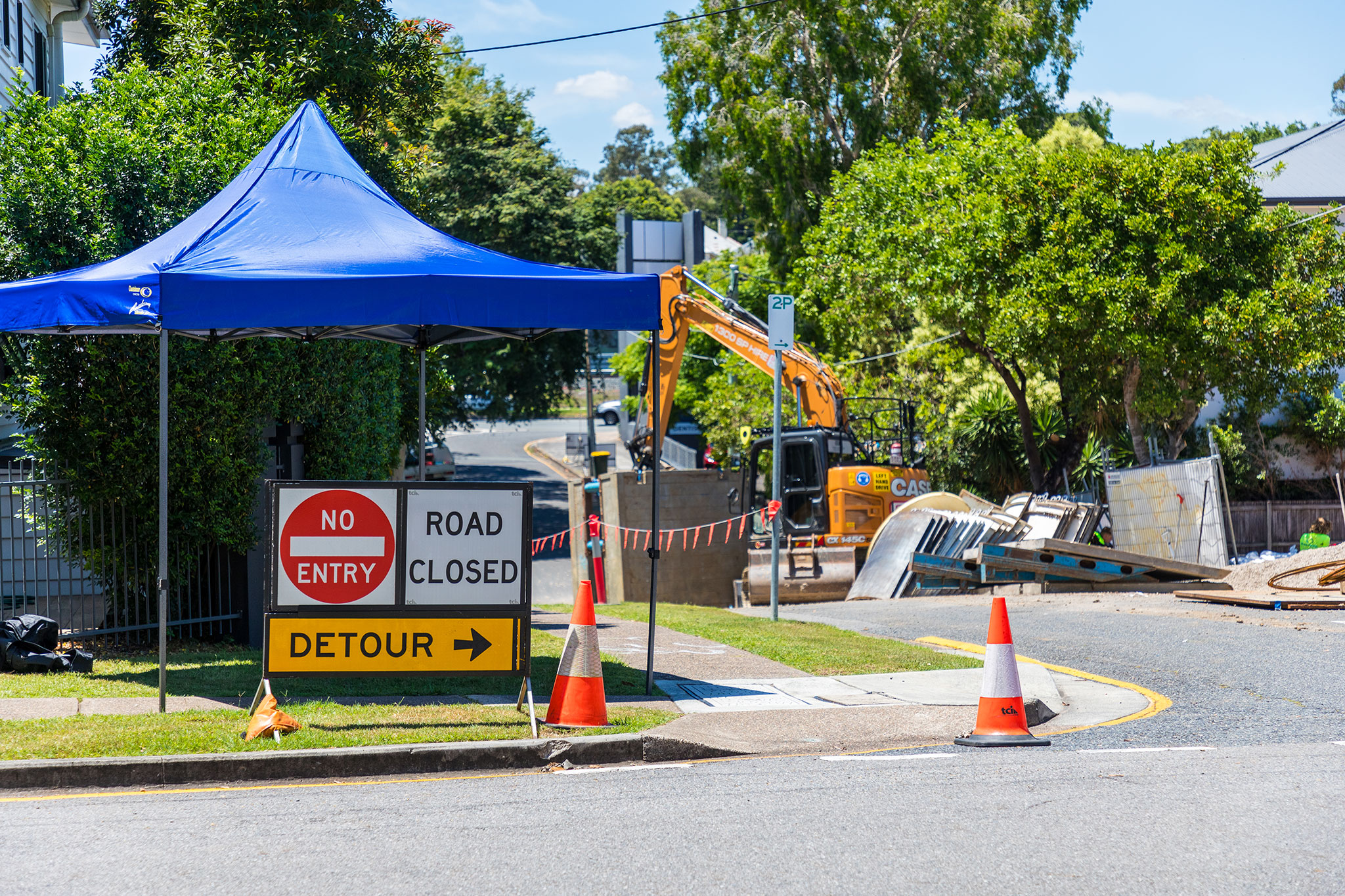 Road closure at Devon Street, Yeronga with detour sign on the footpath.