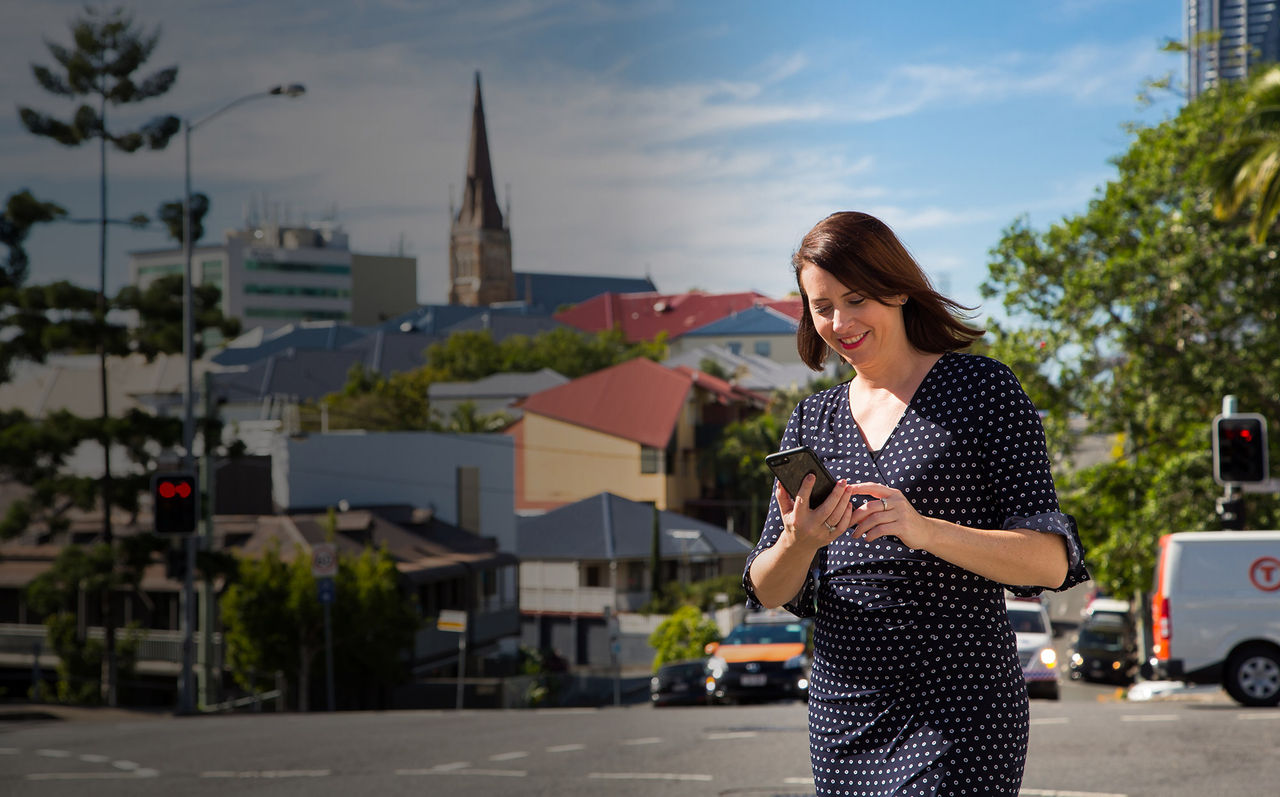 Woman using her mobile in Brisbane