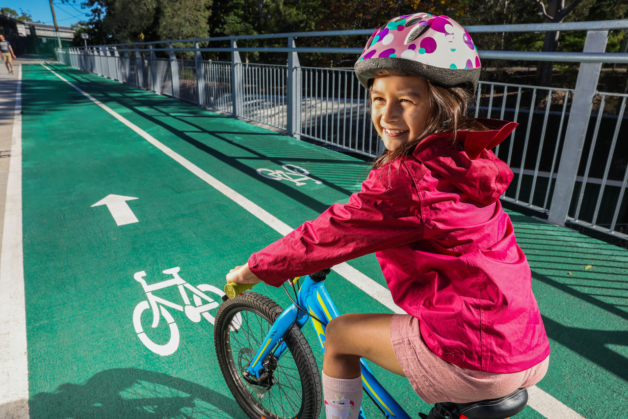 Image of a child riding a bike.