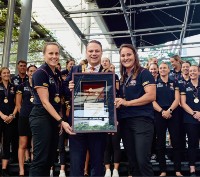 Lord Mayor Adrian Schrinner presenting the key to the city of Brisbane