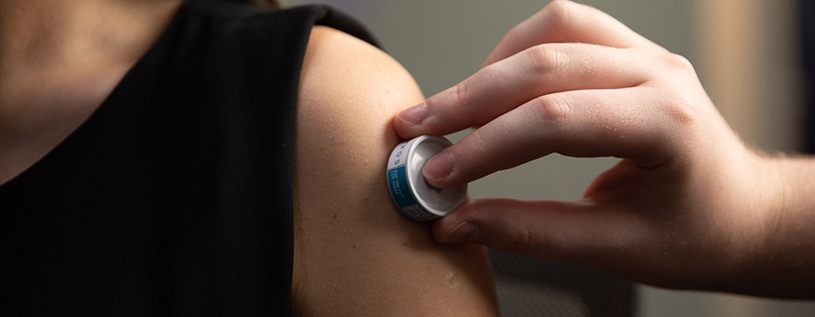 Image showing VAXXAS needle-free vaccination being used on person's shoulder