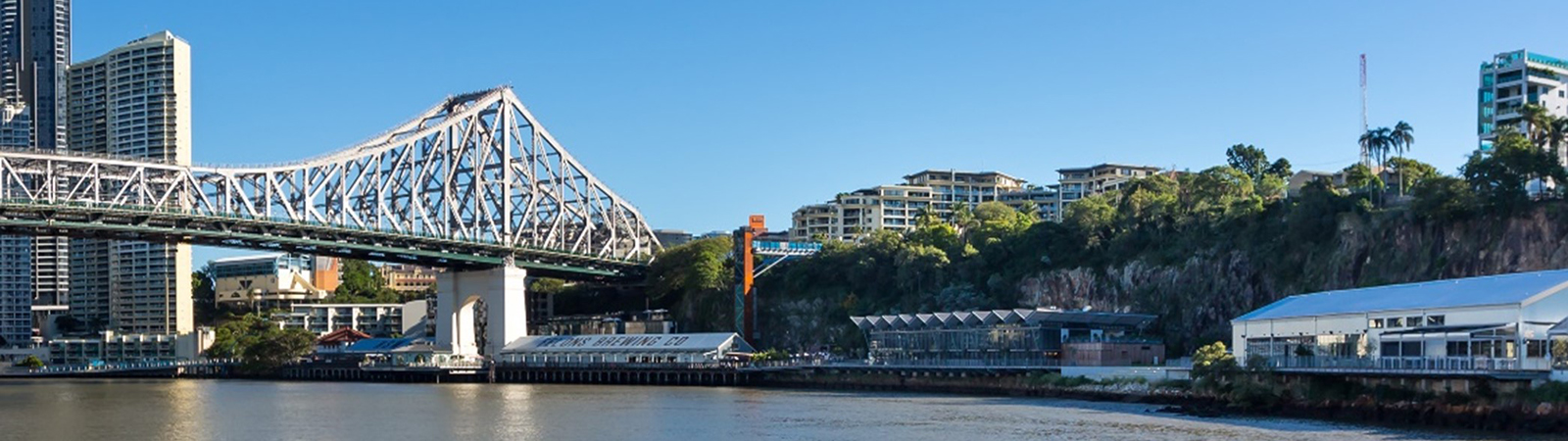 This image is taken from the Brisbane River looking at the Howard Smith Wharves precinct, the cliff face, and the story bridge.