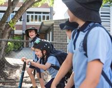 Brisbane school children on scooters