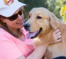Golden Retriever with woman in Calamvale District Park dog off-leash area