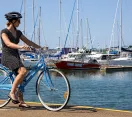 Woman cycling along Manly foreshore